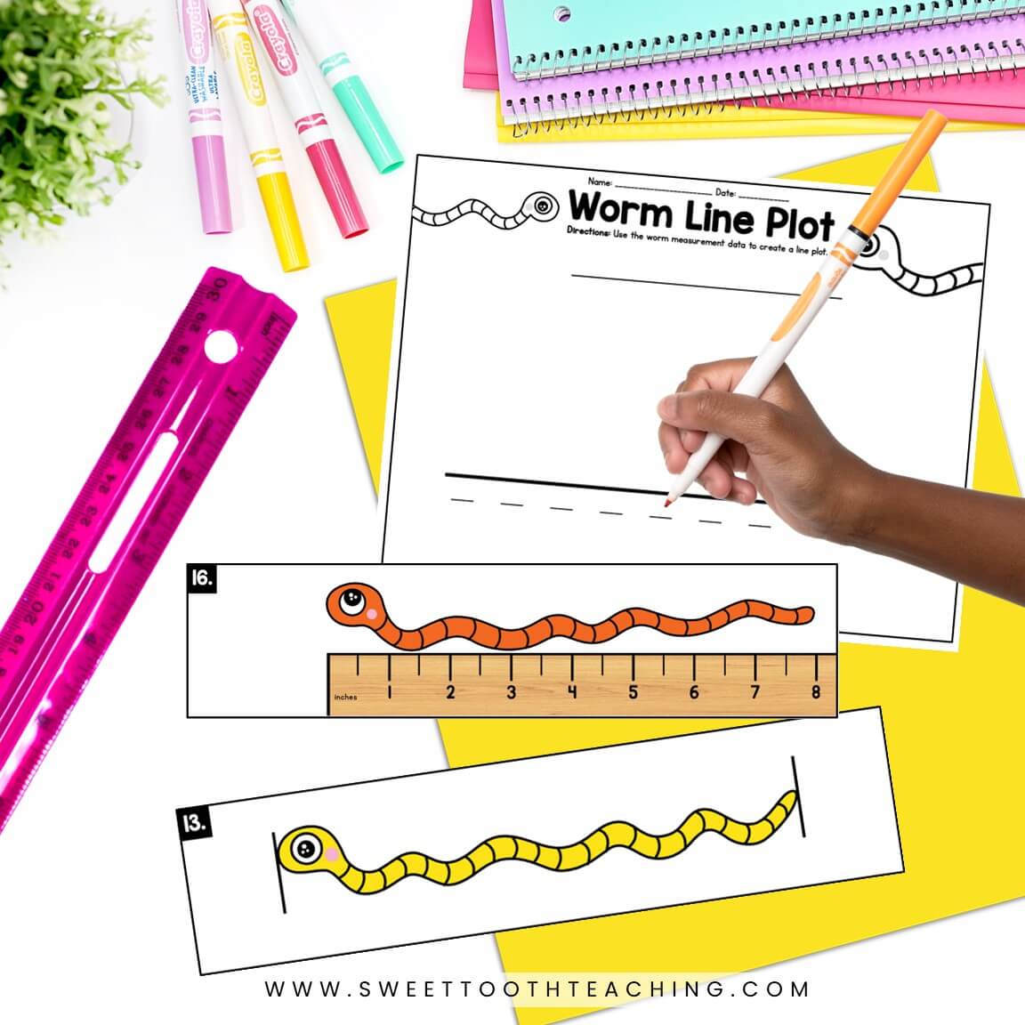 Student using orange marker to complete Worm Line Plot activity; surrounded by math manipulatives, measurement cards, and supplies.